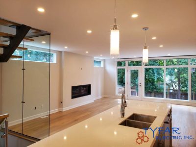 Balanced lighting design combining task, ambient, and feature lighting. Full kitchen lighting installation with recessed and pendant fixtures in Ottawa home