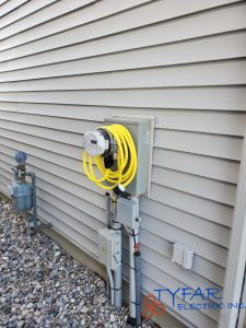 GenerLink installed directly at the meter for safe portable generator connection. GenerLink meter-mounted transfer device installed on home electrical service in Ottawa