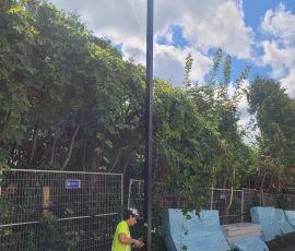 Electrician working on exterior light pole at 3430 Carling Avenue